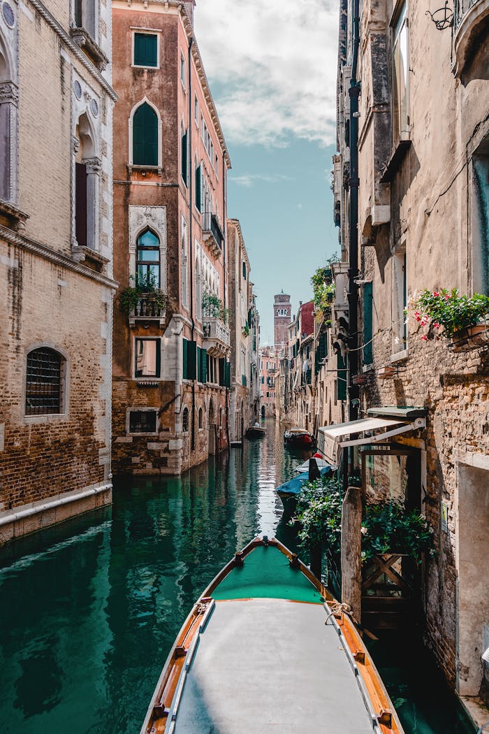 why-choose-us Captivating view of a traditional Venetian canal surrounded by historic buildings, perfect for travel enthusiasts.